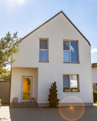Outside view of a simple private contemporary house on a sunny day